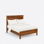 High angled view of a farmhouse panel bed, looking down on the side rails, square legs and low capped footboard.