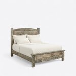 Diagonal angled view showing the right side of a rustic panel bed, with an arched plank headboard and a low capped footboard.