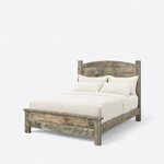 Diagonal angled view showing the left side of a rustic panel bed, with an arched plank headboard and a low capped footboard.