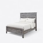 Diagonal angled view showing the left side of a farmhouse panel bed, with a louvered headboard and a low panel footboard.