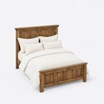 High angled view of a Craftsman panel bed, looking down on the capped headboard and four-panel footboard on square legs.