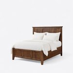 Diagonal angled view showing the left side of a Shaker panel bed, with a three-panel headboard and matching footboard.