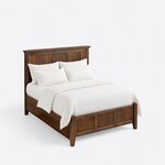 High angled view of a Shaker panel bed, looking down on the corniced headboard, deep side rails and three-panel footboard.