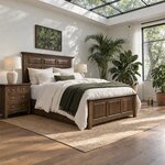 Diagonal angled room view showing the right side of a mantel panel bed with a three-panel footboard, in a skylit bedroom.