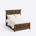 High angled view of a mantel panel bed, looking down on the tall headboard, plain side rails and low three-panel footboard.