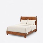 Diagonal angled view showing the left side of a contemporary sleigh bed, with curved head posts and a low footboard.