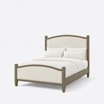 Diagonal angled view showing the left side of an Art Deco upholstered bed, with an arched headboard and matching footboard.