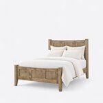 Diagonal angled view showing the left side of a modern panel bed, with a three-panel headboard and matching footboard.