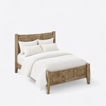 High angled view of a modern panel bed, looking down on the three-panel footboard, square posts and plain side rails.