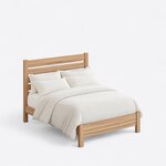 High angled view of a minimalist slat bed, looking down on the slatted headboard, plain side rails and low solid footboard.