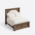 High angled view of a transitional panel bed, looking down on the tufted headboard, side rails and two-panel footboard.