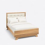 High angled view of a contemporary upholstered bed, looking down on the framed headboard, side rail and low footboard.