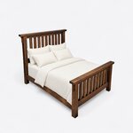 High angled view of a rustic slat bed, looking down on the slatted footboard, straight side rail and square legs.