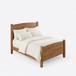 High angled view of a contemporary short post bed, looking down on the arched footboard, side rail and square posts.