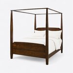 Diagonal angled view showing the left side of a classic canopy bed, with tapered square posts and a solid footboard.