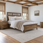 Diagonal angled room view showing the right side of a contemporary panel bed with a lattice headboard, in a beamed room.