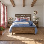 Front room view of a contemporary panel bed with a lattice-top headboard, in a shiplap bedroom with gingham curtains.