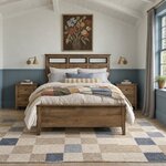 Front room view of a contemporary panel bed with three open headboard inserts, in a bedroom with blue beadboard wainscoting.