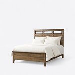 Diagonal angled view showing the left side of a contemporary panel bed, with open headboard inserts and a low footboard.