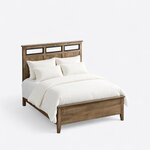 High angled view of a contemporary panel bed, looking down on the open-insert headboard, low footboard and tapered foot legs.