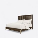 Diagonal angled view showing the left side of a modern slat bed, with a metal-barred headboard and metal-capped foot legs.