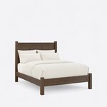Diagonal angled view showing the right side of a transitional panel bed, with a three-panel headboard and capped posts.