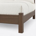 Footboard close-up of a transitional panel bed, showing the low footboard, a stepped post cap and a square leg.