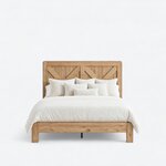Front view of the Fulton bed, with a tall two-panel headboard and a low foot rail between stout square legs.