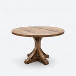 Diagonal angled view showing the right side of a rustic dining table, with a round top and a curved-brace pedestal.