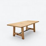Diagonal angled view showing the right side of a farmhouse trestle table, with a rectangular top and a metal stretcher.