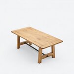 High angled view of a farmhouse trestle table, showing a rectangular top with breadboard-style ends and rounded corners.