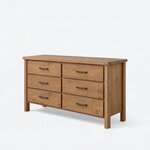 Diagonal angled view showing the left side of a modern dresser, with six flat-front drawers and a recessed side panel.