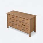 High angled view of a modern dresser, showing a broad rectangular slab top projecting slightly beyond the case.