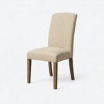 Diagonal angled view showing the left side of a Parsons side chair, with a tall back and four tapered legs.