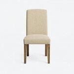Front view of a Parsons side chair, with a tall, gently crowned back and a padded seat on tapered legs.