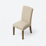 High angled view of a Parsons side chair, showing a padded seat with rounded corners beneath a tall back.