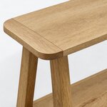 Top corner close-up of a farmhouse console table, showing a rounded corner, an end-cap seam and an eased edge.