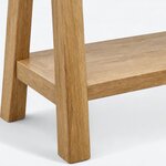 Leg close-up of a farmhouse console table, showing a flat-sided leg with rounded foot corners and a lower shelf joint.