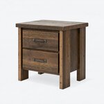 Diagonal angled view showing the left side of a rustic nightstand, with two drawers and a slab top on block legs.