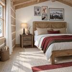 Diagonal angled room view showing the right side of a rustic nightstand with two drawers, in a log-walled bedroom.