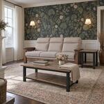 Diagonal angled room view showing the left side of an industrial coffee table with a shelf, in a floral-wallpapered room.