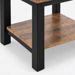 Leg close-up of an industrial end table, showing a square leg extending below the lower shelf and its support rail.