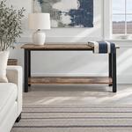 Front room view of a rustic console table with a long top and a low shelf, in a modern farmhouse living room.