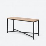 Diagonal angled view showing the left side of an industrial console table, with a slab top and an X-braced metal base.