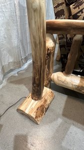 wood base of rustic log floor lamp