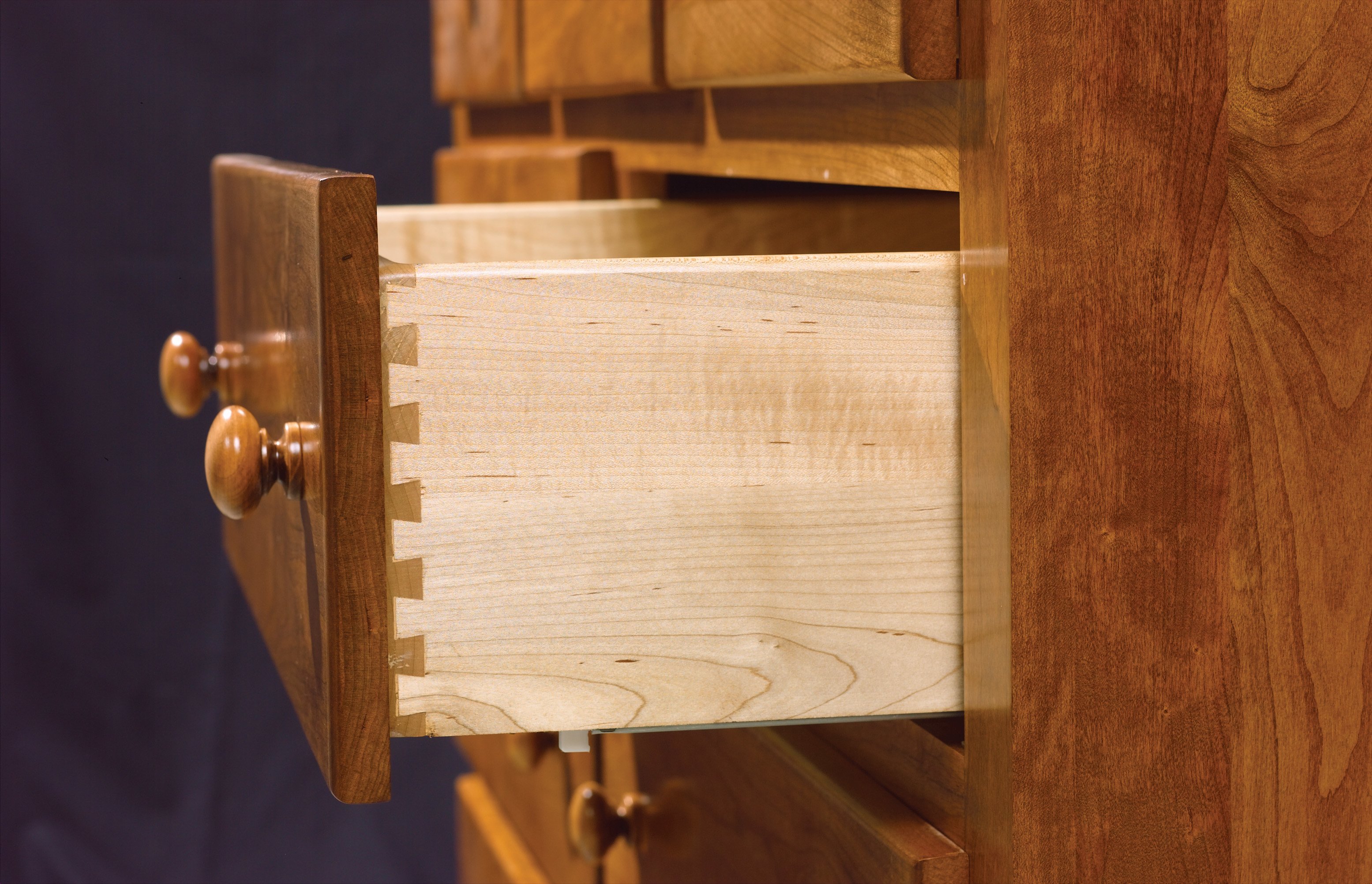 soft-close under mount drawer slide on solid wood dovetailed drawer box.