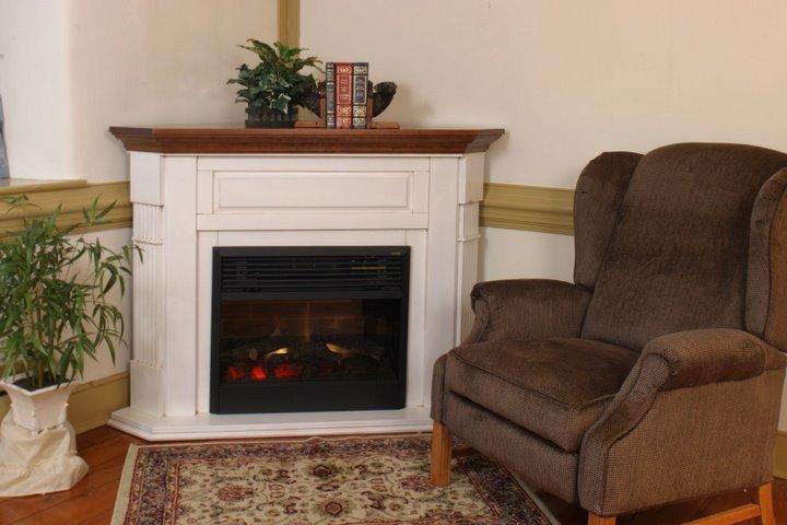 Corner Electric Fireplace from DutchCrafters Amish Furniture This Fluted Corner Electric Fireplace will fit perfect in the corner of your home or office. Choose from having this handcrafted in your choice of red oak wood